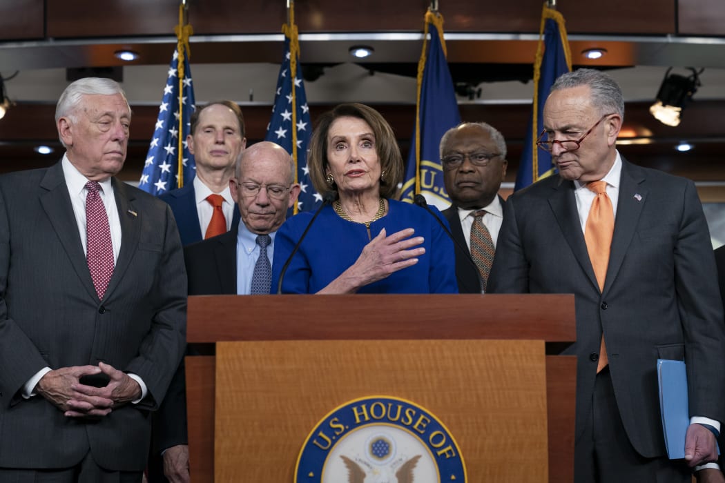 Speaker of the House Nancy Pelosi,centre, Senate Minority Leader Chuck Schumer, right, and other congressional leaders speaking to media about the failed meeting with President Donald Trump at the White House on 22 May 2019.