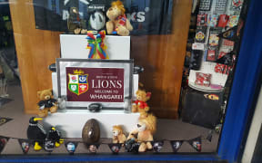 Whangārei puts out the welcome mat for the Lions: display in Rathbone Gifts window.