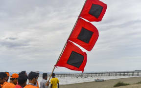 Bangladeshi volunteers warn people to leave their homes and take shelter due to ahead of Cyclone Mocha's landfall in Cox's Bazar, Bangladesh.