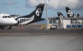 Buses and planes in Auckland sit parked during the covid-19 ouutbreak.