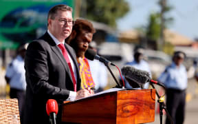 This handout photograph taken on August 7, 2022 and released by Australia's Department of Foreign Affairs and Trade shows Australian Minister for International Development and the Pacific, and the Minister for Defence Industry, Pat Conroy speaking at the Solomon Scouts and Coastwatchers commemorative service to mark the 80th anniversary of the Battle of Guadalcanal in Honiara on Solomon Islands. (Photo by DION ISAACSON / AUSTRALIA'S DEPARTMENT OF FOREIGN AFFAIRS AND TRADE / AFP) / --- RESTRICTED TO EDITORIAL USE - MANDATORY CREDIT "AFP PHOTO / AUSTRALIAN DEPARTMENT OF FOREIGN AFFAIRS AND TRADE/ DION ISAACSON " - NO MARKETING NO ADVERTISING CAMPAIGNS - DISTRIBUTED AS A SERVICE TO CLIENTS ---