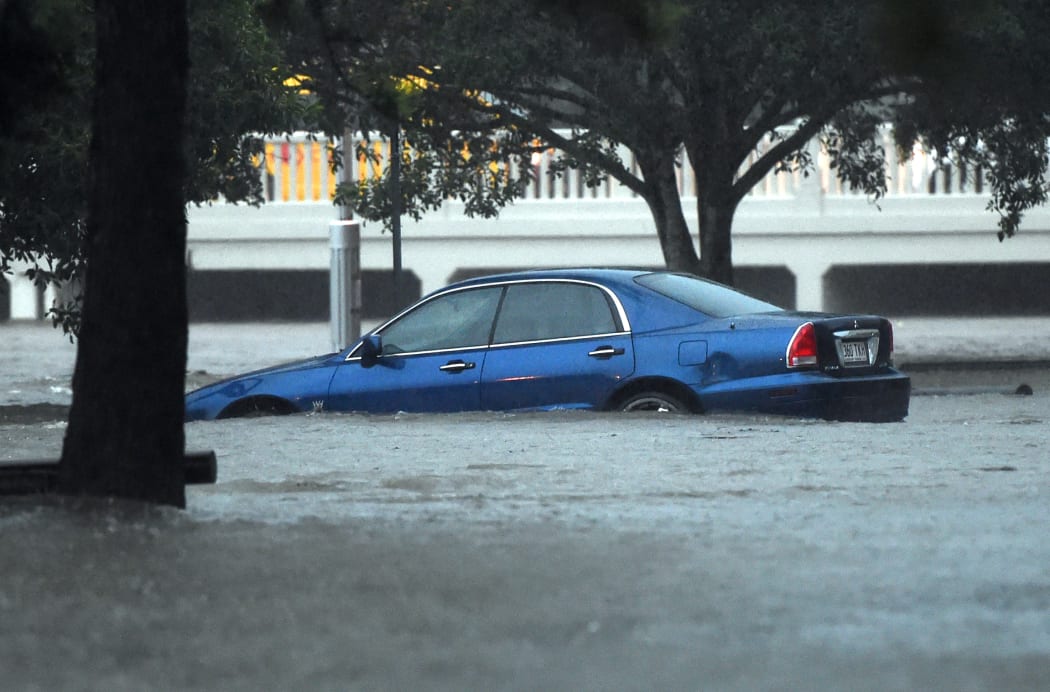 A car is submerged in flood water in Stones Corner in Brisbane on Friday 1 May 2015.