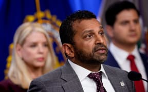 FBI Director Kash Patel (R), accompanied by Attorney General Pam Bondi (L), speaks at a news conference to announce the indictment of a former Olympic snowboarder Ryan Wedding, charging him with murder and money laundering in connection to a drug trafficking organization at the Justice Department on November 19, 2025 in Washington, DC. The Justice Department announced a fifteen-million-dollar reward for information leading to the arrest of Ryan James Wedding, the leader of a criminal drug organization who smuggled large quantities of cocaine through Colombia and Mexico for distribution in the United States and Canada.