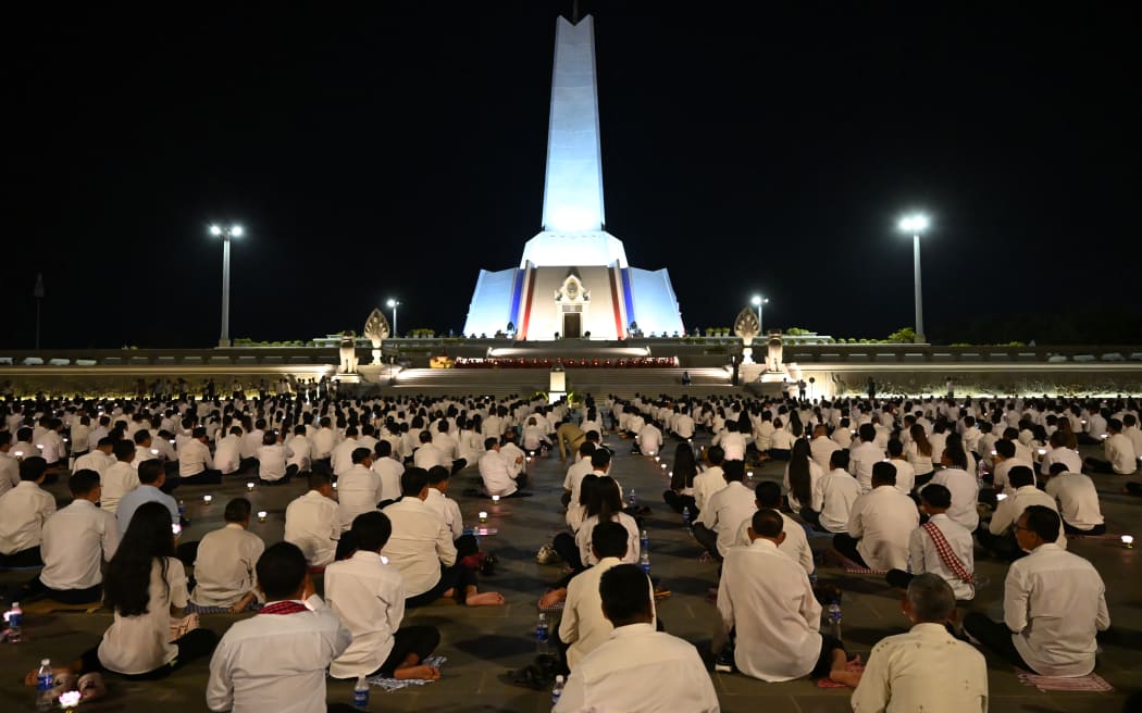 Participants attend a prayer for peace at Win-Win memorial in Phnom Penh on 29 December, 2025, after Thailand and Cambodia agreed to an "immediate" ceasefire on 27 December following renewed border clashes that killed dozens of people and displaced more than a million this month.