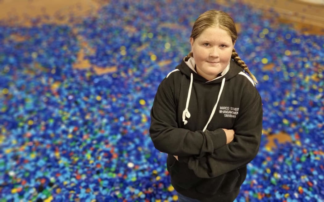 Paige Jordan of Marco School which won the prize for collecting the most lids relative to its size.