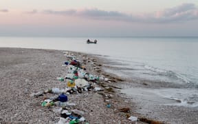 Plastic debris lines the coast in Haiti.