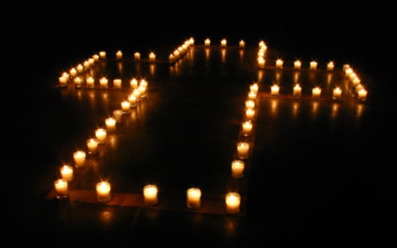 Cross of candles. arrangement made by Yun-Yu Hsieh and people from Austin Chinese Campus Christian Fellowship (ACCCF); at Gonzales, Texas, USA.