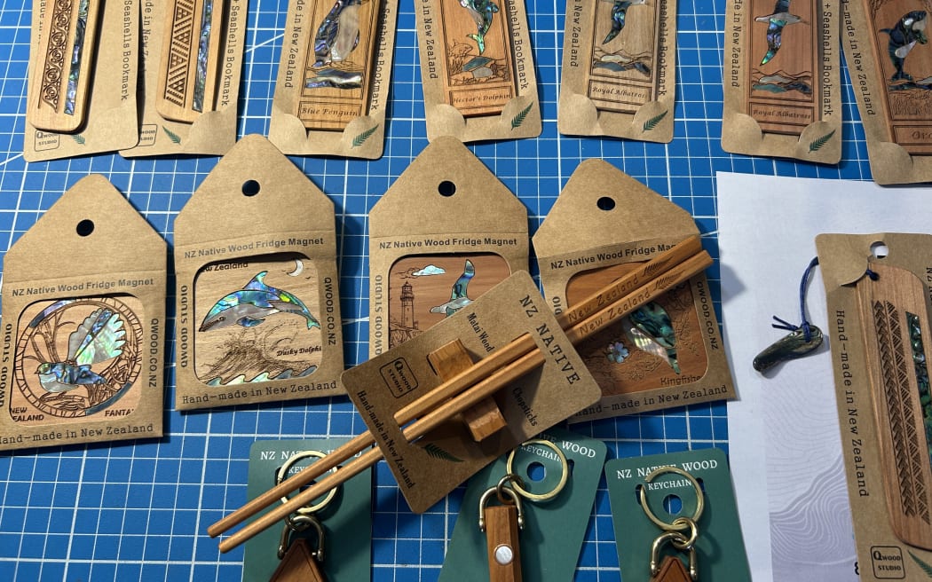 Picture shows a display of various woodwork products, with a pair of chopsticks in the middle.