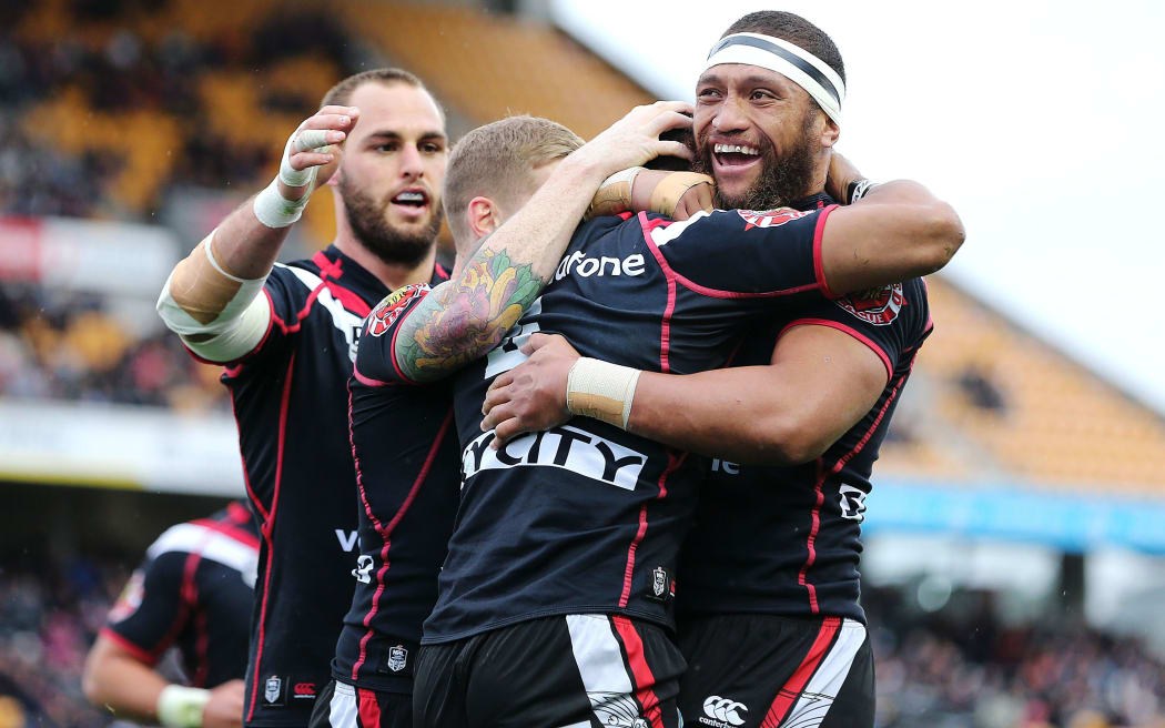 The Warriors celebrate Dominique Peyroux's try.