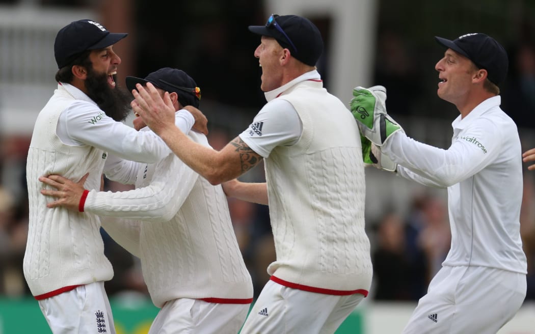 Moeen Ali (left) celebrates catching Trent Boult to win the first test at Lord's.