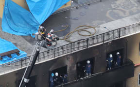 This aerial view shows the rescue and recover scene after a fire at an animation company building killed some two dozen people in Kyoto on July 18, 2019.