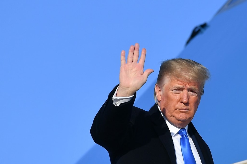US President Donald Trump makes his way to board Air Force One before departing from Andrews Air Force Base in Maryland on December 7, 2019.