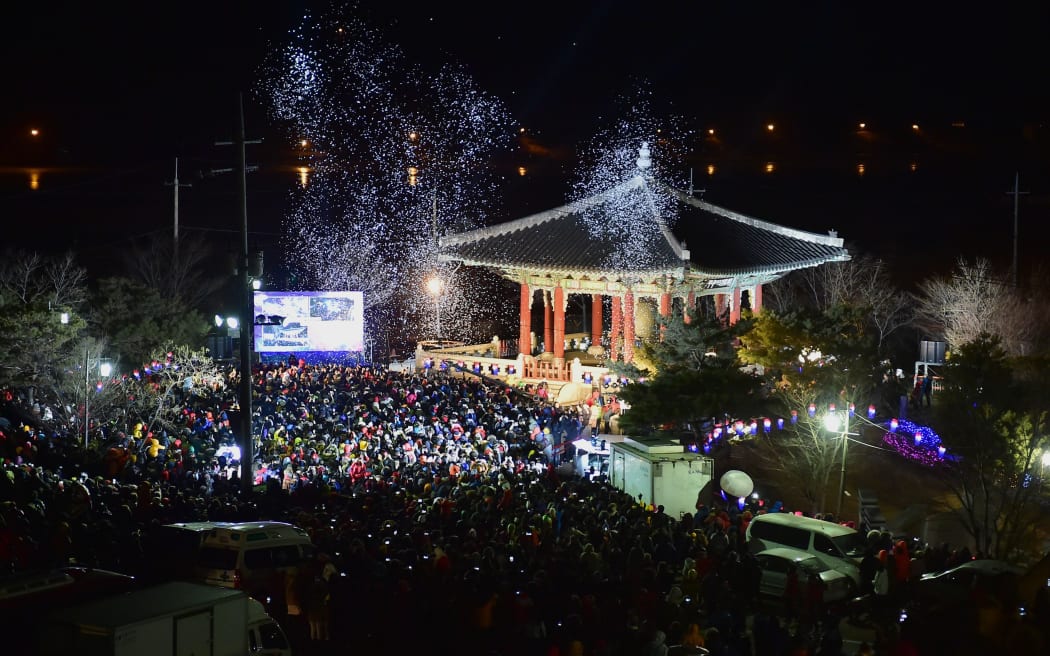 South Koreans gather during the welcoming ceremony of the New Year at Imjingak peace park in the border city of Paju.