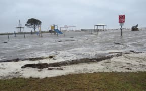 Flooding hits a playground on Carters Beach on the West Coast.