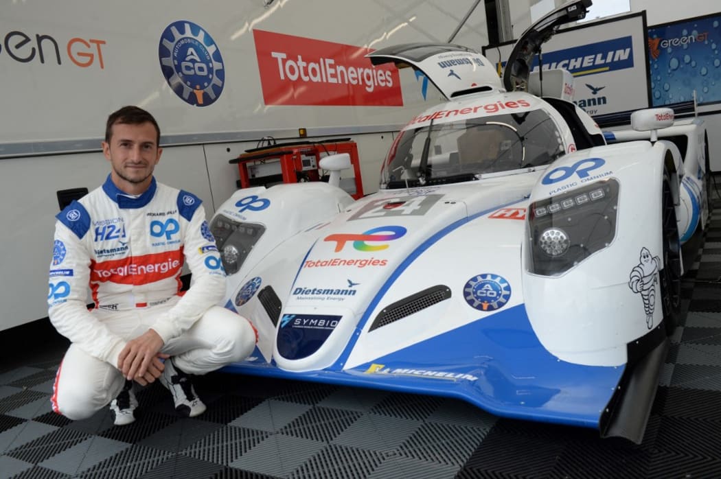 Driver Stephane Richelmi poses next to the Mission H24 prototype, which transforms hydrogen into electricity which fuels the car. The team hopes to takes part as a 24 Hours of Le Mans race in 2024.
