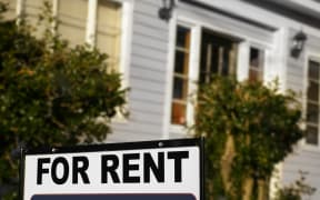 House  with "For Rent" sign in front