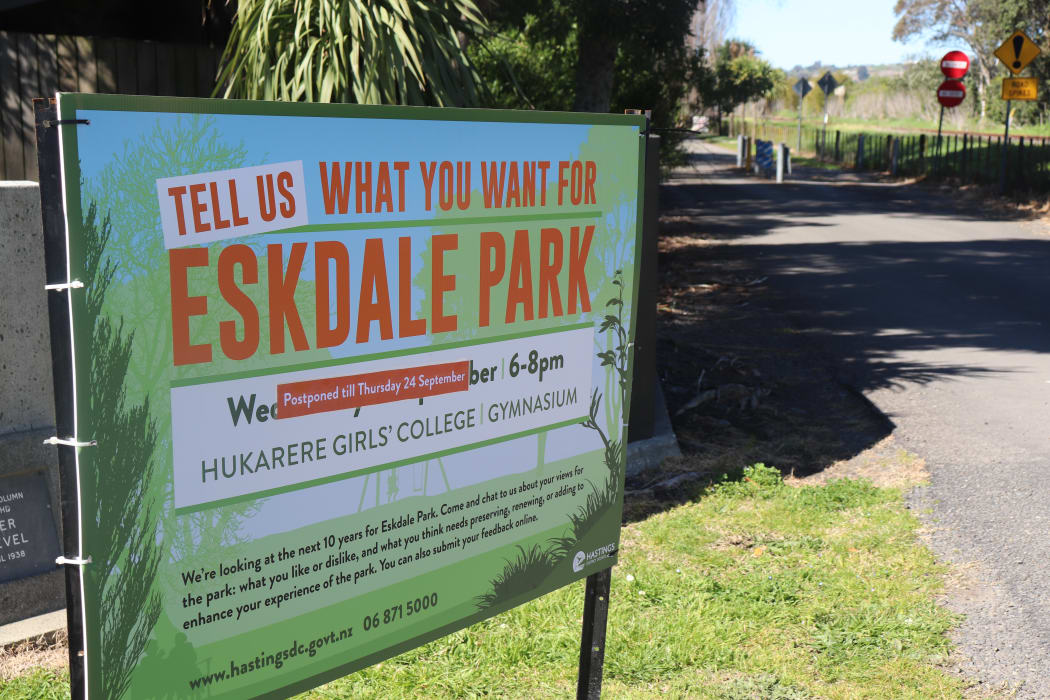 A council ad outside the park for an upcoming community meeting