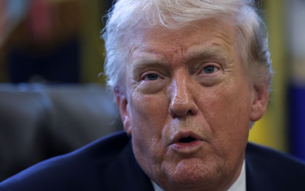 WASHINGTON, DC - MARCH 16: U.S. President Donald Trump speaks to the media after signing a document during a White House signing ceremony in the Oval Office of the White House on March 16, 2026 in Washington, DC. Trump signed an executive order to create a task force on fraud which will be lead by Vice President J.D. Vance.   Alex Wong/Getty Images/AFP (Photo by ALEX WONG / GETTY IMAGES NORTH AMERICA / Getty Images via AFP)