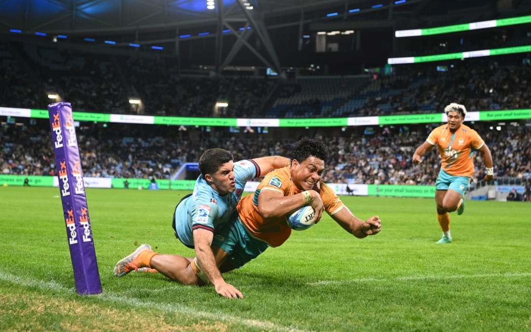 Miracle Fai'ilagi of Moana Pasifika scores during the Super Rugby Pacific 2023.