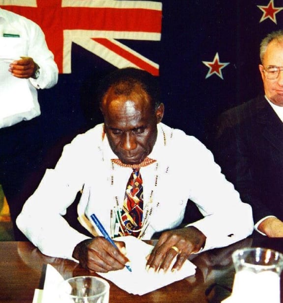 PNG Bougainville Premier Gerard Sinato signs the "Burnham Declaration" in 1997, which set in motion an end to the civil war.