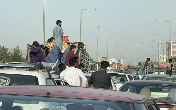 An Afghan family flee Kabul city, Afghanistan, on August 15, 2021.