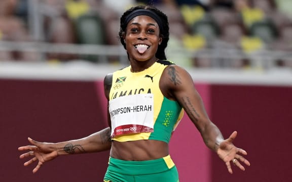 Jamaica's Elaine Thompson-Herah wins the women's 200m final during the Tokyo 2020 Olympic Games at the Olympic Stadium in Tokyo on August 3, 2021.