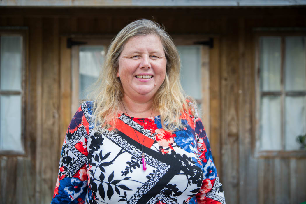 Danielle Bergin outside some of the Island Child Charitable Trust's emergency housing.
