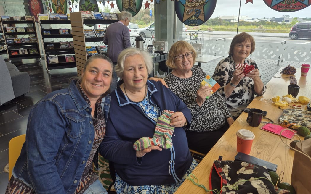 Wendy Paltridge and her mother Lenore Paltridge, Val Foster, and Fern Clay working on Christmas gifts together at Te Manawa's Caffeine and Craft group.