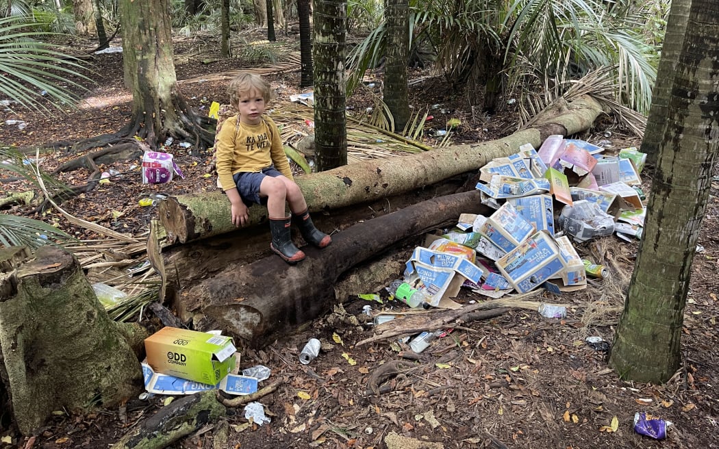 Sam Gibson and his three-year-old son Rehua (pictured) discovered the rubbish in Makauri Bush when they went to pick mushrooms.