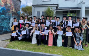 A group of students on Castle St celebrate their graduation
