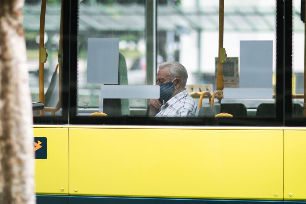 A bus passenger wears a mask during level 2 in Wellington, 15 February 20201.