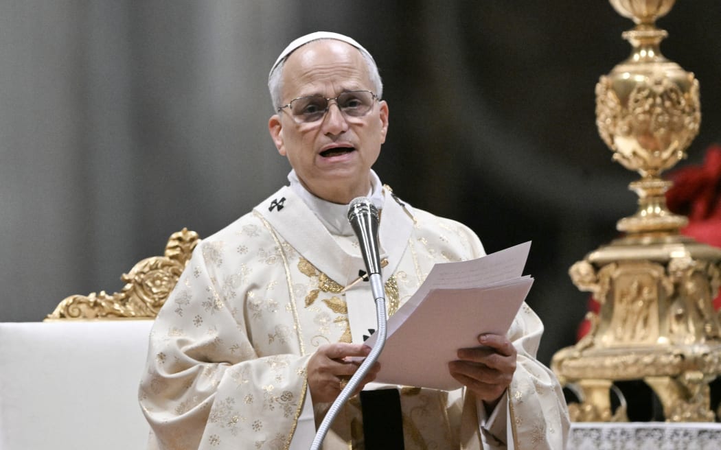 Pope Leo XIV addresses faithfull as he performs the Christmas mass at St Peter's Basilica in the Vatican on December 25, 2025. (Photo by Tiziana FABI / AFP)