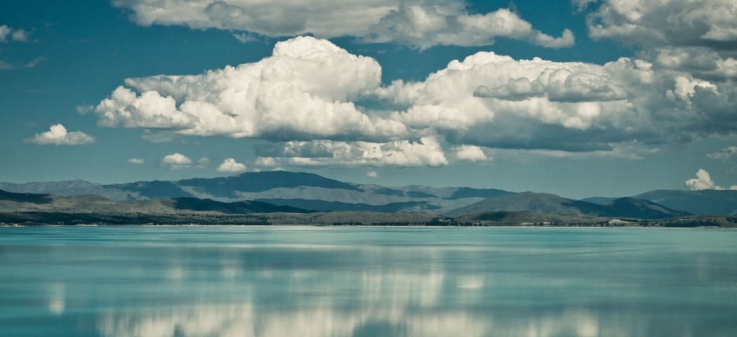 View of harbour with clouds and water reflections