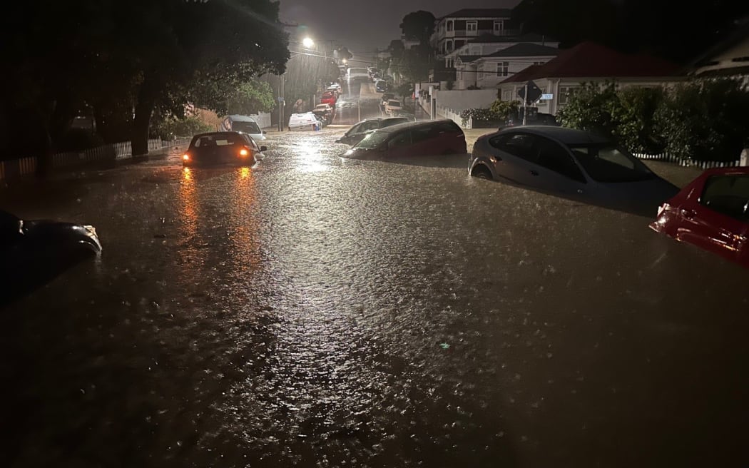 Cars in floodwater on Wright Street in the Wellington suburb of Mt Cook, where residents said the Papawai Stream overwhelmed the local stormwater network