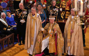 King Charles III with the St Edward's Crown on his head attends the Coronation Ceremony inside Westminster Abbey in central London on 6 May, 2023. - The set-piece coronation is the first in Britain in 70 years, and only the second in history to be televised. Charles will be the 40th reigning monarch to be crowned at the central London church since King William I in 1066. Outside the UK, he is also king of 14 other Commonwealth countries, including Australia, Canada and New Zealand. Camilla, his second wife, will be crowned queen alongside him and be known as Queen Camilla after the ceremony. (Photo by Aaron Chown / POOL / AFP)