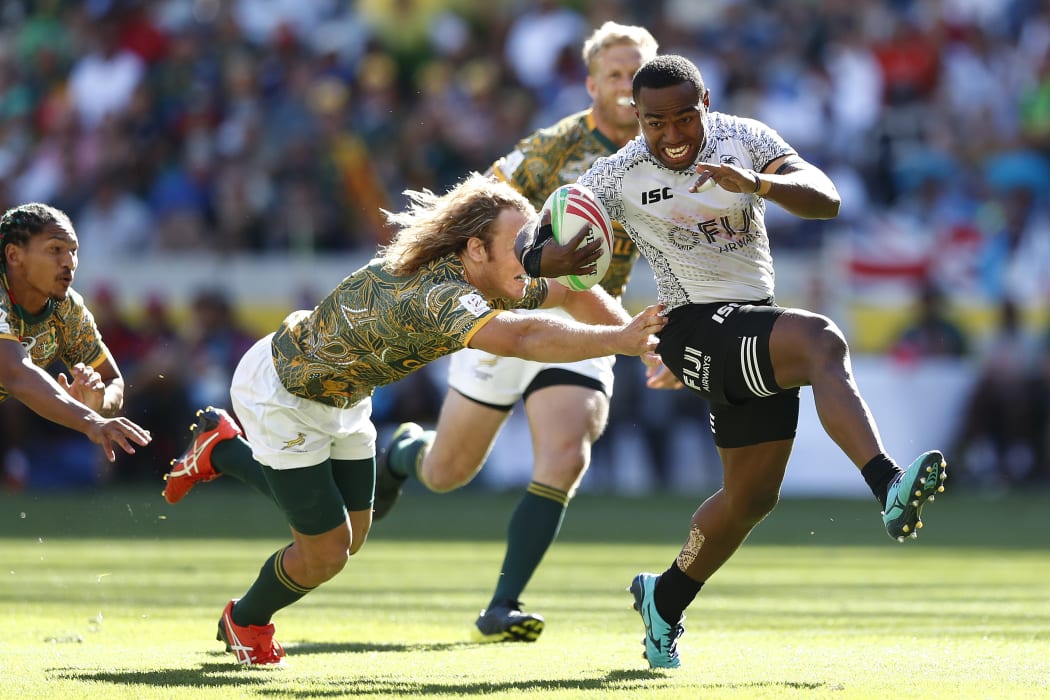 Fiji's Waisea Nacuqu breaks through the Blitzboks defence.