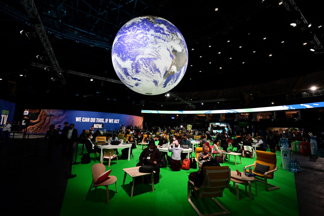 Delegates attend the third day of the COP26 UN Climate Summit in Glasgow, 3 November 2021.