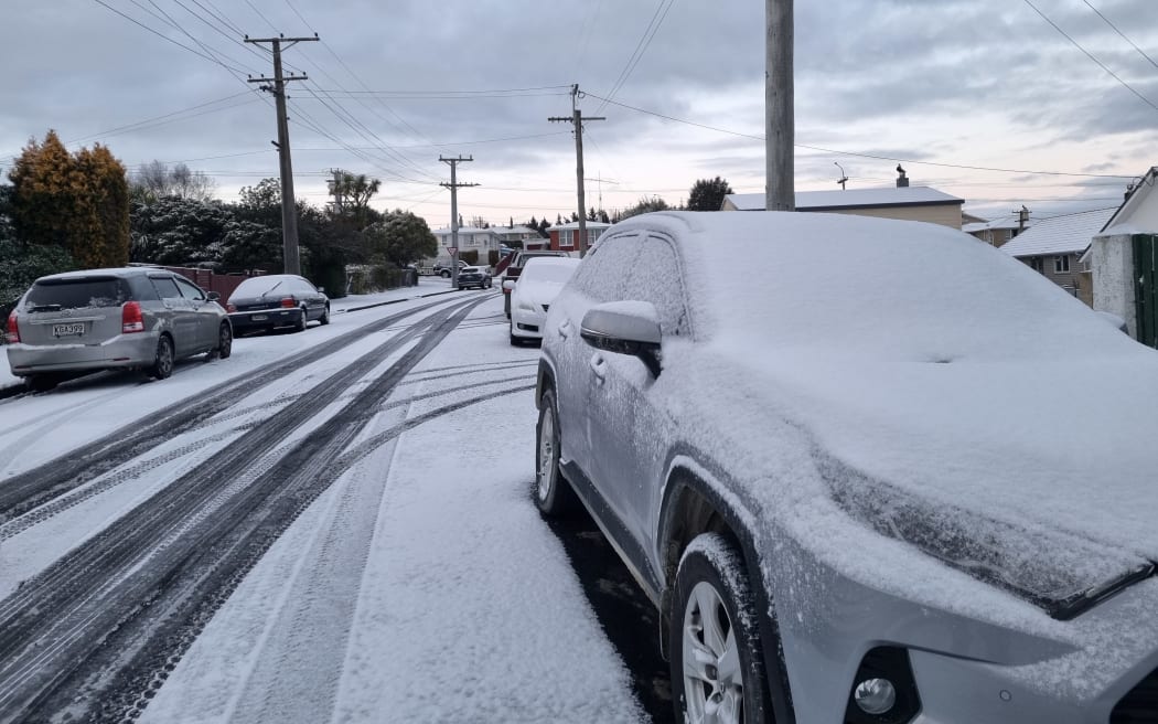 Snow settled on cars in the  Dunedin hill suburb of Brockville, Tuesday 6 September 2022.