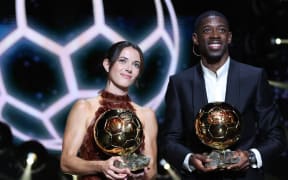 Paris Saint-Germain's French forward Ousmane Dembele and Barcelona's Spanish midfielder Aitana Bonmati pose after receiving the Ballon d'Or awards, 2025.