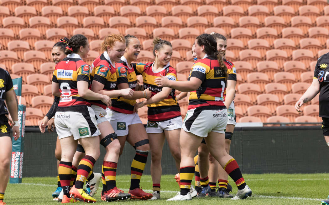 Waikato's Kelsey Teneti is congratulated by team mates.