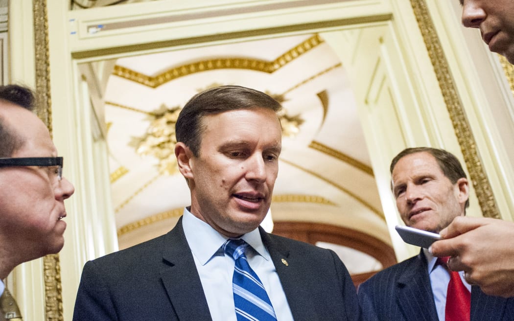 Senator Chris Murphy speaks to reporters after waging an almost 15-hour filibuster on the Senate floor in order to force a vote on gun control on June 15.