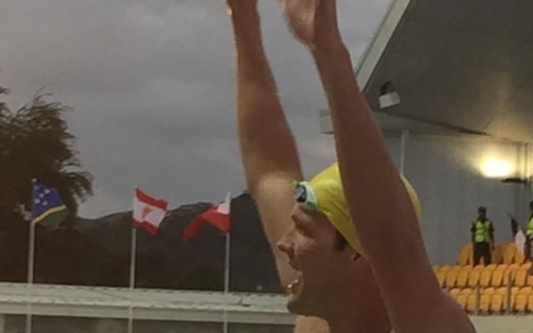 Ryan Pini waves to the crowd after winning gold at the 2015 Pacific Games in Port Moresby.