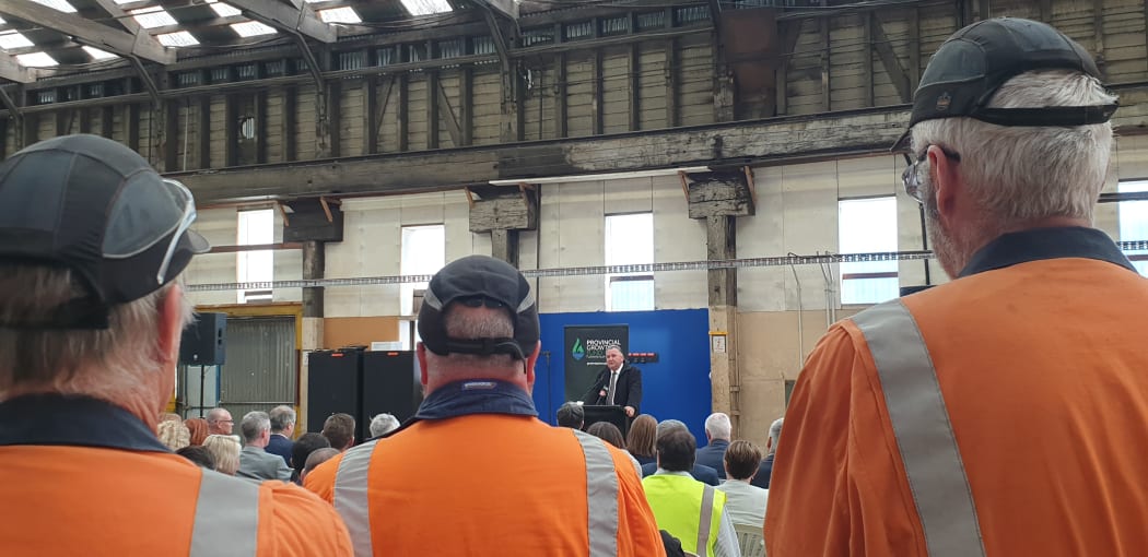 Workers listen as Regional Development Minister Shane Jones  announces nearly $$20m from the Provincial Growth Fund for upgrades.to Dunedin's Hillside workshop.