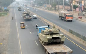 Trucks transport army tanks on a road in Muridke, about 30 kilometres from Lahore, on May 7, 2025.