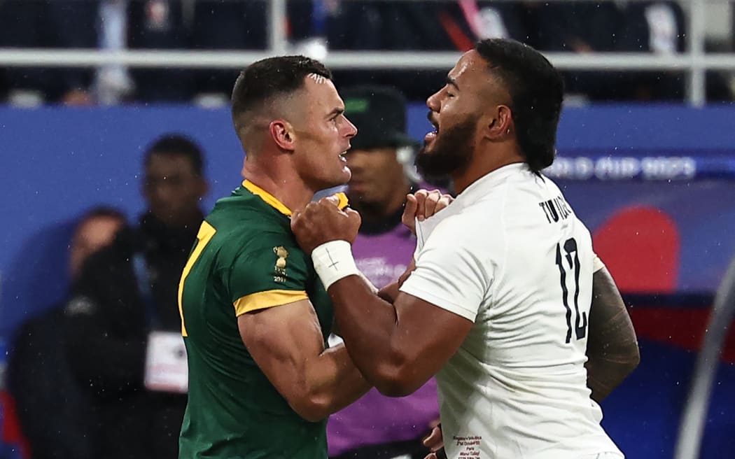 Jesse Kriel and Manu Tuilagi confront each other during the 2023 Rugby World Cup semi-final match between England and South Africa at the Stade de France.