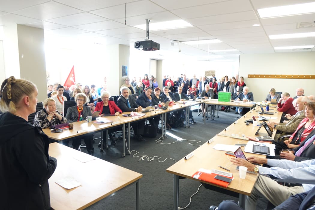 Anna Huffstutler (left) addresses the meeting in Dunedin.