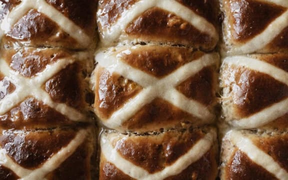 A section of fresh made hot cross buns.