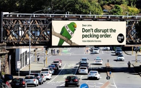 A billboard showing the RealNZ kākāriki karaka Bird of the Century campaign.