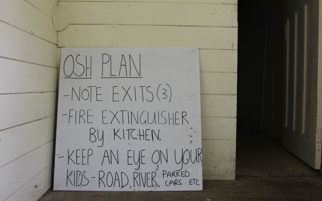 The Belvedere Hall’s occupational safety and health sign on the back of a repurposed billboard.