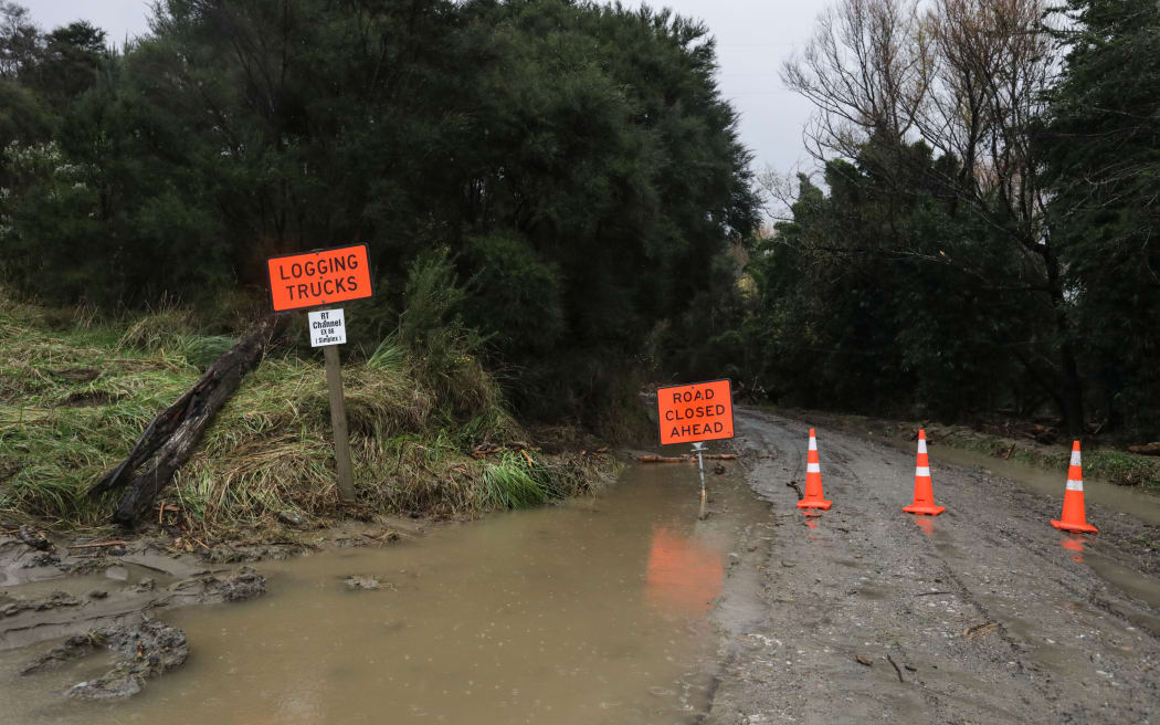 Tolaga Bay, heavy rain forced piles of wood onto farmland.